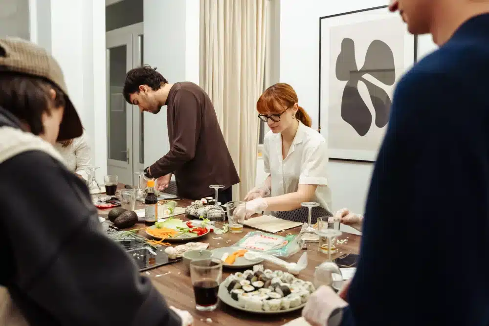 Residents making sushi together at an Urban Campus community workshop
