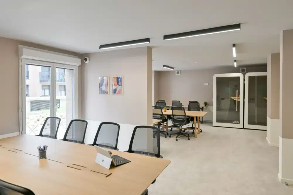 Coworking space at Urban Campus La Maillerie in Lille, shared desks and meeting table