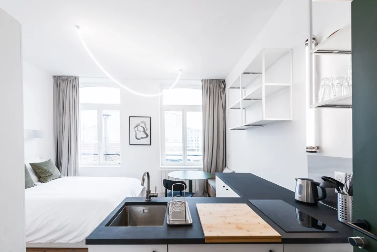 Kitchenette with bed view in a studio at Urban Campus Lille Saint So' Coliving
