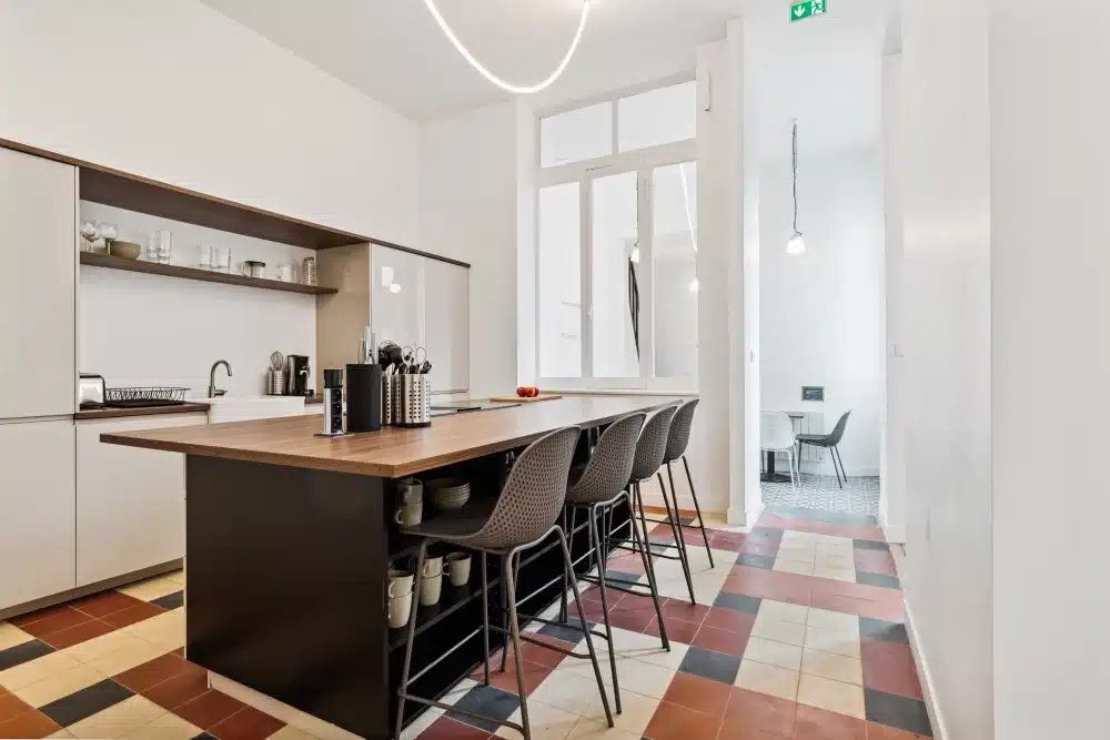 Common kitchen with central island at Urban Campus Lille Saint So' Coliving