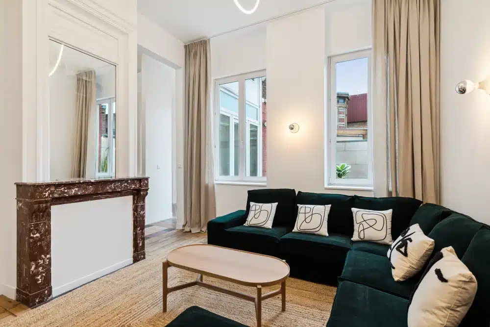 Common lounge with marble fireplace at Urban Campus Lille Saint So' Coliving