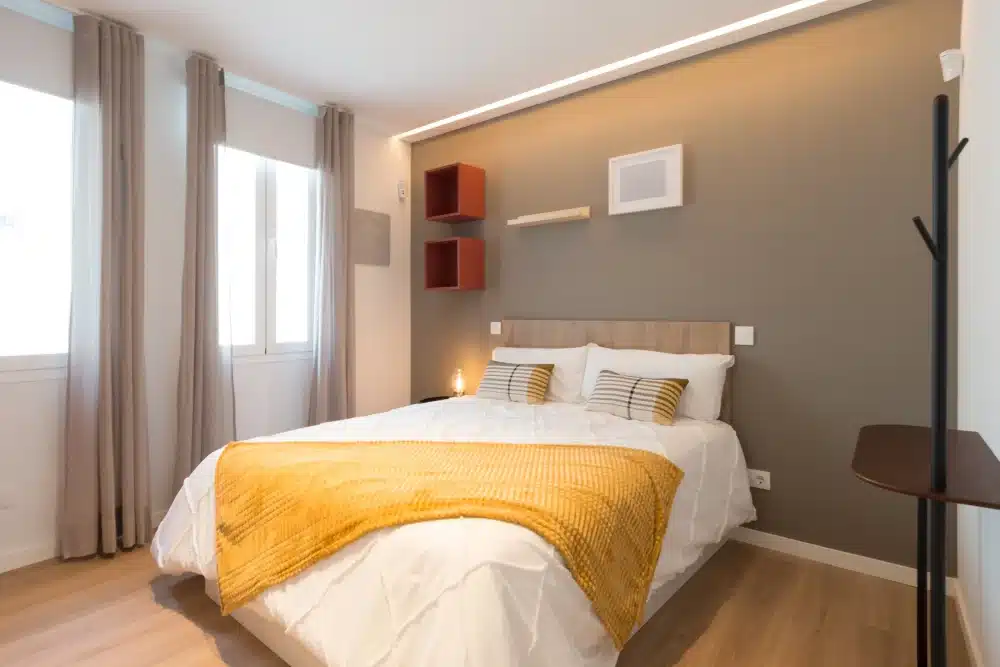 Bedroom at Urban Campus Madrid Atocha Coliving, bed with wall storage cubes