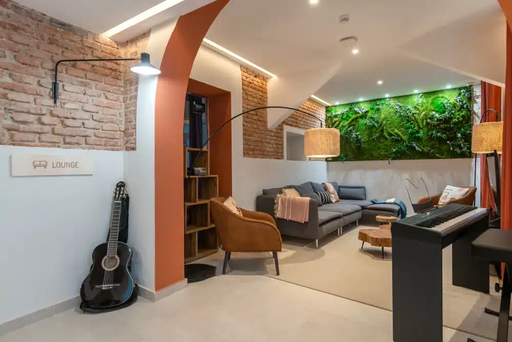 Common lounge at Urban Campus Atocha Madrid, music corner with piano and guitar