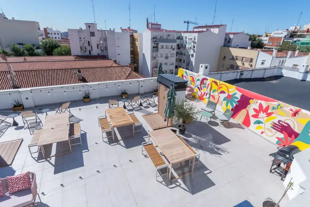 Rooftop terrace at Urban Campus Atocha Madrid, outdoor tables with city views