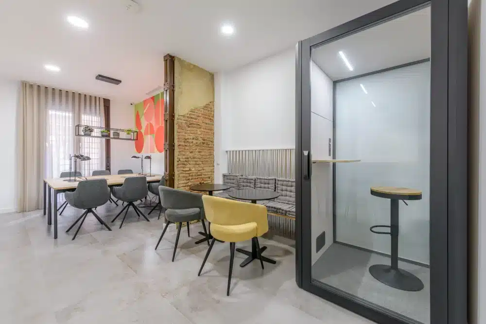 Coworking space with phone booth at Urban Campus Avenida América Coliving in Madrid