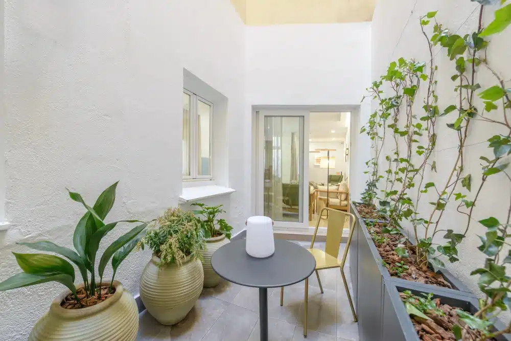 Outdoor patio with plants at Urban Campus Avenida América Coliving in Madrid