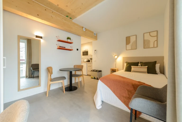 Studio apartment with dining area and bed at Urban Campus Cuatro Caminos, Coliving in Madrid