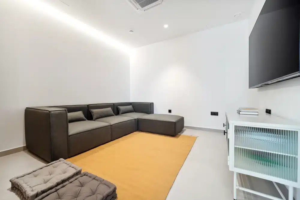 Common lounge at Urban Campus Ayora Coliving in Valencia, sofas and shared relaxation area