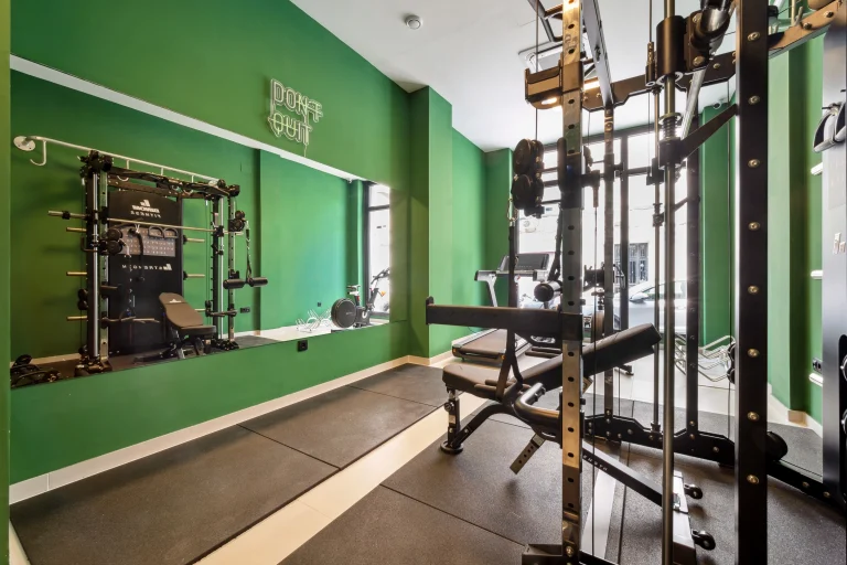 Fitness room at Urban Campus Ayora Coliving in Valencia, full strength training equipment